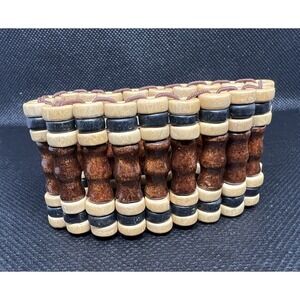 Wide wood stretch bracelet with a mix of brown and light brown wood beads